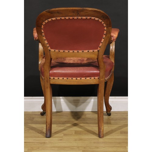 1870 - A Victorian walnut desk chair, cartouche shaped back carved with acanthus, stuffed-over upholstery, ... 