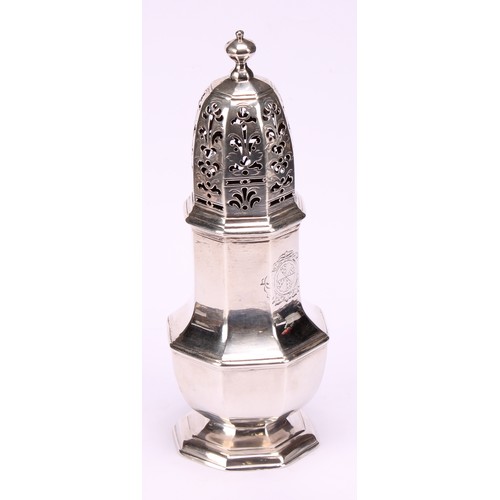 624 - A George II silver octagonal baluster sugar caster, knop finial, pierced cover, domed foot, crested,... 