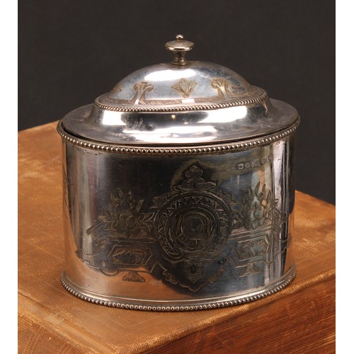 563 - A Victorian E.P.N.S oval tea caddy, bright-cut engraved with strapwork, leaves and flowers, hinged d... 