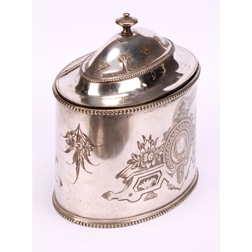 563 - A Victorian E.P.N.S oval tea caddy, bright-cut engraved with strapwork, leaves and flowers, hinged d... 