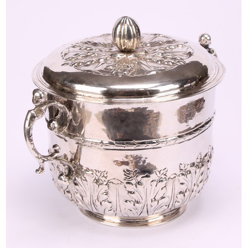 595 - A Charles II silver porringer and cover, chased with stiff acanthus, bun finial, pricked initials RP... 