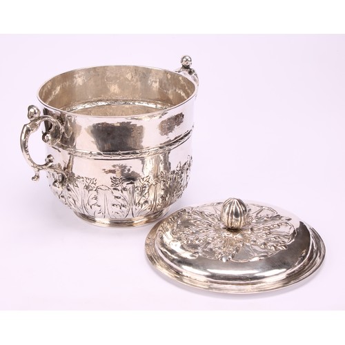 595 - A Charles II silver porringer and cover, chased with stiff acanthus, bun finial, pricked initials RP... 