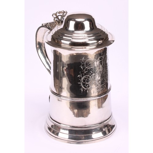 645 - A George III silver spreading cylindrical tankard, hinged domed cover, pierced chair-back thumbpiece... 