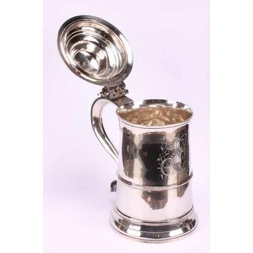 645 - A George III silver spreading cylindrical tankard, hinged domed cover, pierced chair-back thumbpiece... 