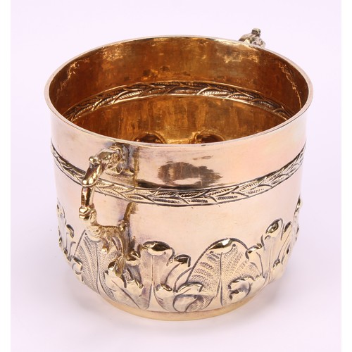 678 - A James II silver-gilt porringer, chased with a laurel girdle and a band of acanthus, 14cm over grot... 