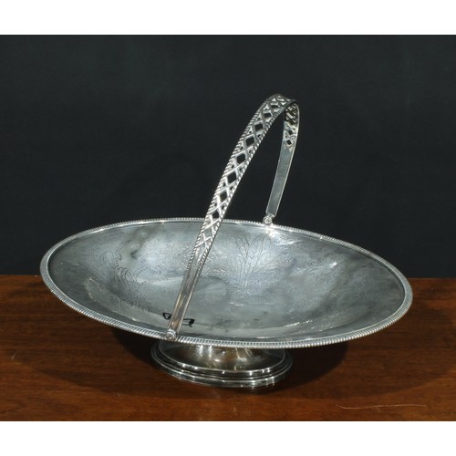 562 - A Victorian E.P.N.S oval swing-handled cake basket, bright-cut engraved with leaves and ferns, gadro... 