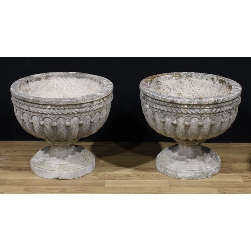 1471 - A pair of 19th century style reconstituted stone garden urns, cast as half-fluted with rope twist bo... 