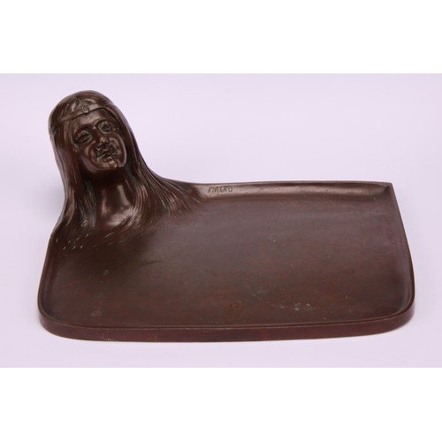 1301 - An Art Nouveau brown patinated bronze vide poche, cast as the head of a girl with sinuous flowing ha... 