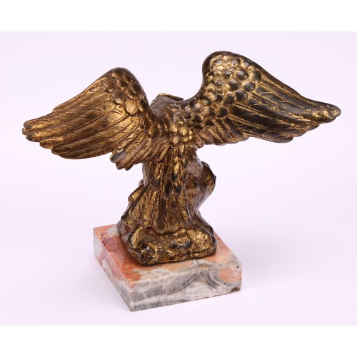 1911 - An early 20th century gilt metal novelty pocket watch stand, cast as an eagle grasping a snake, squa... 