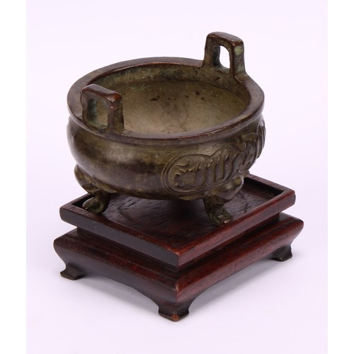 202 - A Chinese bronze ding tripod censer, for the Islamic market, cast with Arabic calligraphy, verse fro... 