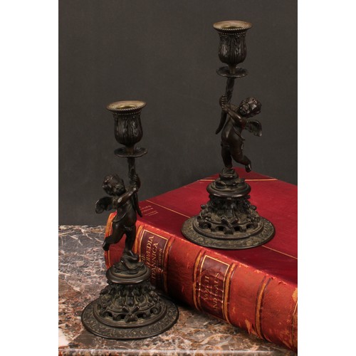 1569 - A pair of 19th century bronze figural candlesticks, cast in the renaissance revival taste as scantil... 