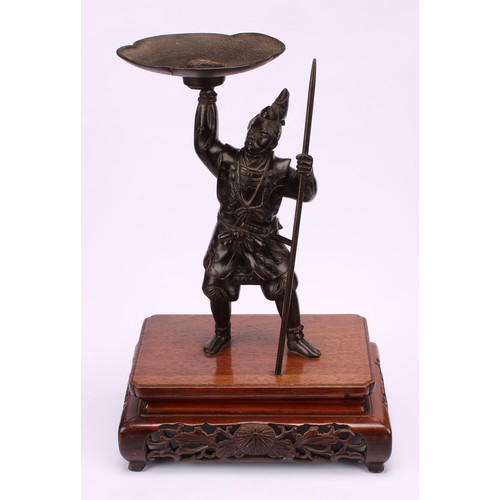 276 - Japanese School (Meiji period), a brown patinated bronze, of a samurai warrior, he stands holding al... 