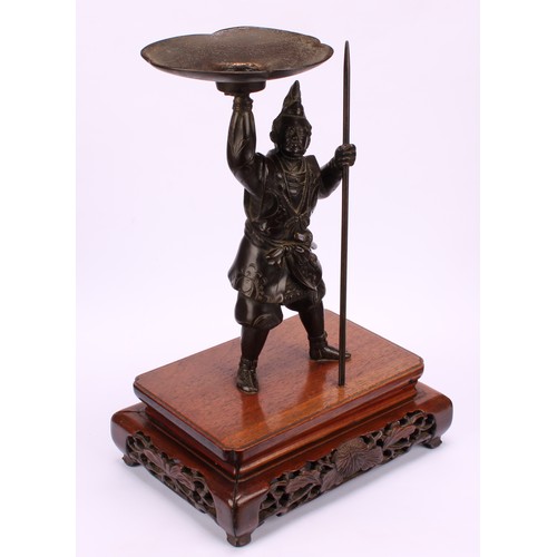 276 - Japanese School (Meiji period), a brown patinated bronze, of a samurai warrior, he stands holding al... 