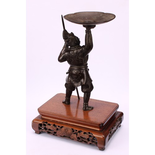 276 - Japanese School (Meiji period), a brown patinated bronze, of a samurai warrior, he stands holding al... 