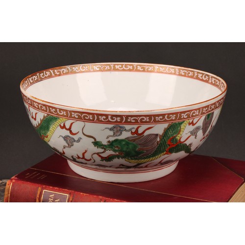 191 - A large 19th century Chinese punch bowl, decorated in polychrome enamels with scrolling dragons, the... 