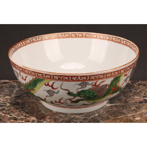 191 - A large 19th century Chinese punch bowl, decorated in polychrome enamels with scrolling dragons, the... 