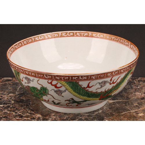 191 - A large 19th century Chinese punch bowl, decorated in polychrome enamels with scrolling dragons, the... 