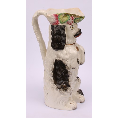 5 - A 19th century Staffordshire toby jug, modelled as a spaniel, on hind legs begging, the rim with fru... 