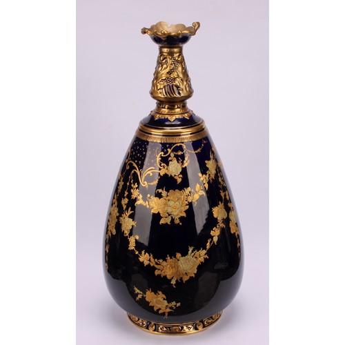 121 - A Royal Crown Derby ovoid vase, decorated in gilt with flowers and swags on a cobalt blue ground, 35... 