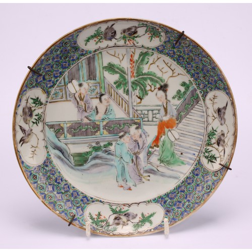 267 - A pair of Chinese circular plates, painted in polychrome with domestic scenes, 20cm diameter, 19th c... 