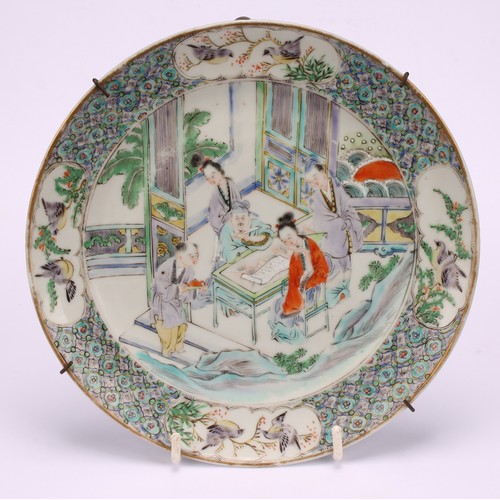 267 - A pair of Chinese circular plates, painted in polychrome with domestic scenes, 20cm diameter, 19th c... 