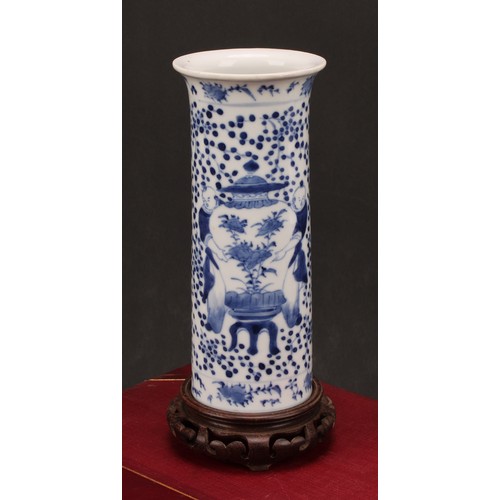 225 - A Chinese sleeve vase, painted in tones of underglaze blue with figures carrying temple jars, four c... 