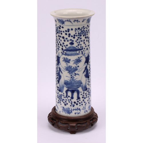 225 - A Chinese sleeve vase, painted in tones of underglaze blue with figures carrying temple jars, four c... 