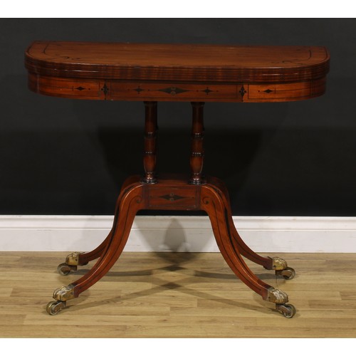 1425 - A Regency mahogany D-shaped card table, hinged top inlaid with naval anchors and enclosing a baize l... 