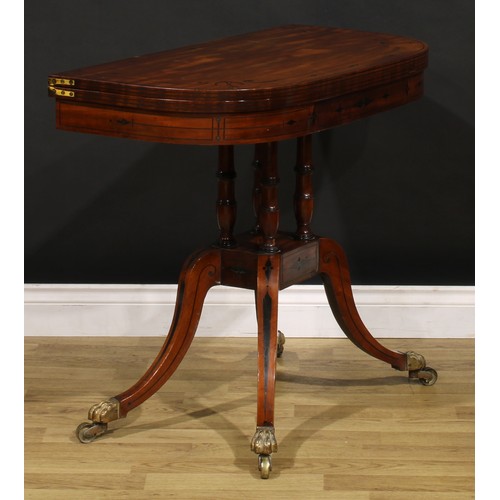 1425 - A Regency mahogany D-shaped card table, hinged top inlaid with naval anchors and enclosing a baize l... 