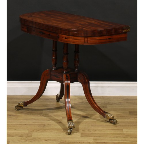 1425 - A Regency mahogany D-shaped card table, hinged top inlaid with naval anchors and enclosing a baize l... 