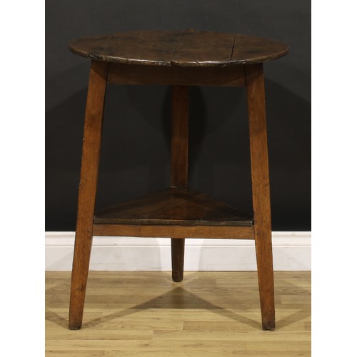 1193 - A George III oak cricket table, circular top, open undertier, 76cm high, 60.5cm diameter, early 19th... 