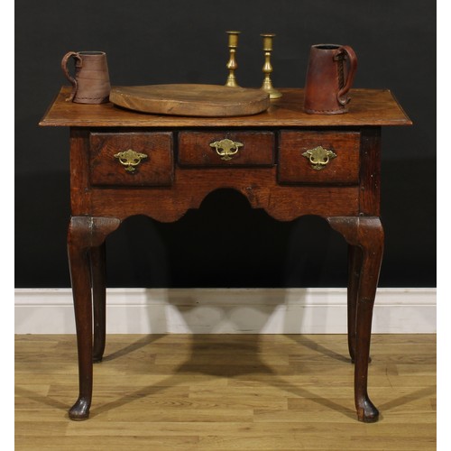 1235 - A George II oak lowboy, oversailing rectangular top above three frieze drawers, engraved brass handl... 