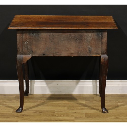 1235 - A George II oak lowboy, oversailing rectangular top above three frieze drawers, engraved brass handl... 