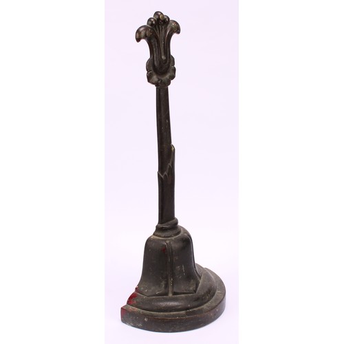 1251 - A post-Regency bronze door stop, cast with lotus, posted handle, demi-lune base, 37cm high, c.1835