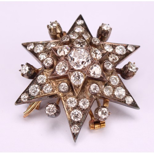 962 - An early 20th century diamond set six pointed star pendant brooch, the whole set with 43 old brillia... 