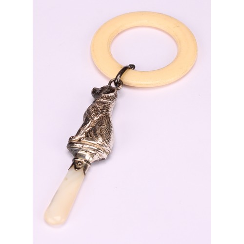 662 - A George V silver novelty baby's rattle, as a dog, mother of pearl haft, ivorine teething ring, 14cm... 