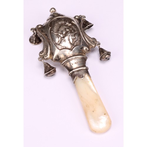 656 - A George V Scottish silver novelty nursery rhyme baby's rattle, embossed with the cow and the moon f... 