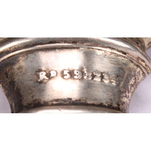 656 - A George V Scottish silver novelty nursery rhyme baby's rattle, embossed with the cow and the moon f... 