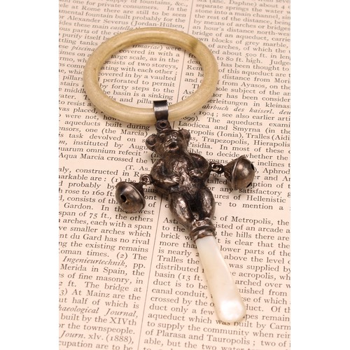 663 - A George V silver novelty baby's rattle, as a teddy bear, mother of pearl haft, ivorine teething rin... 