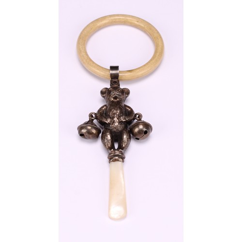 663 - A George V silver novelty baby's rattle, as a teddy bear, mother of pearl haft, ivorine teething rin... 