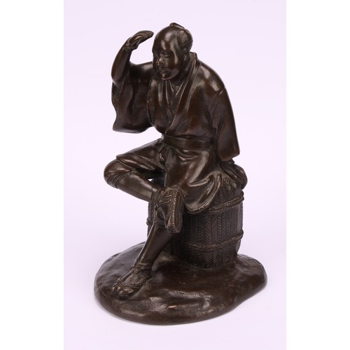 278 - Japanese School (Meiji period) a brown patinated bronze, a fisherman sitting on a basket, 17.5cm hig... 