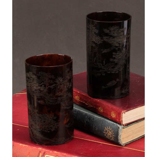 254 - A pair of Chinese tortoiseshell beakers, engraved with monumental landscapes and verse, 10.5cm high,... 