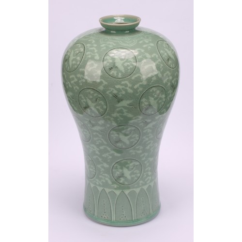 243 - A Korean celadon maebyeong vase, decorated with cranes within roundels on a crackle glazed ground, 2... 