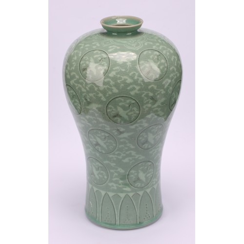 243 - A Korean celadon maebyeong vase, decorated with cranes within roundels on a crackle glazed ground, 2... 