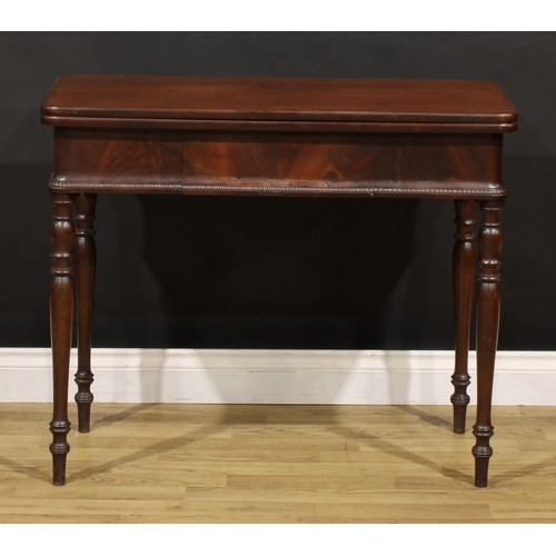 1484 - A 19th century mahogany tea table, hinged top above a frieze drawer, turned legs, 75.5cm high, 92cm ... 