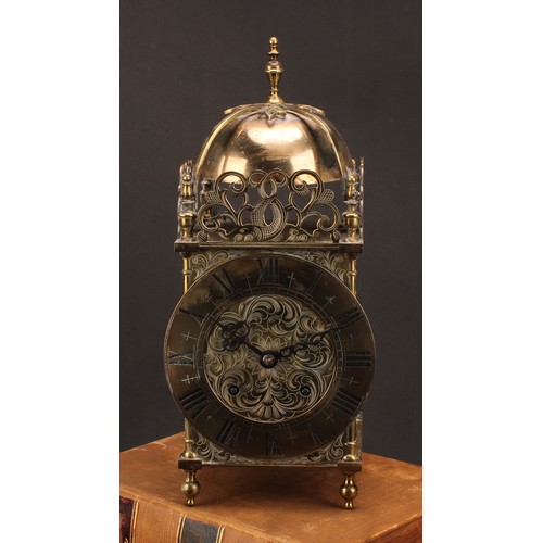 1210 - ***COLLECTING BACK***
A 17th century style brass lantern clock, 17cm chapter ring inscribed with Rom... 