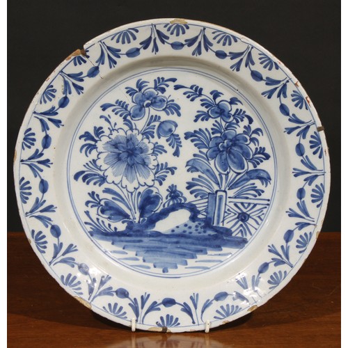 7 - A collection of six 18th and 19th century Delft chargers, the largest 36cm diameter (6)