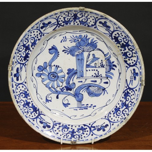 7 - A collection of six 18th and 19th century Delft chargers, the largest 36cm diameter (6)