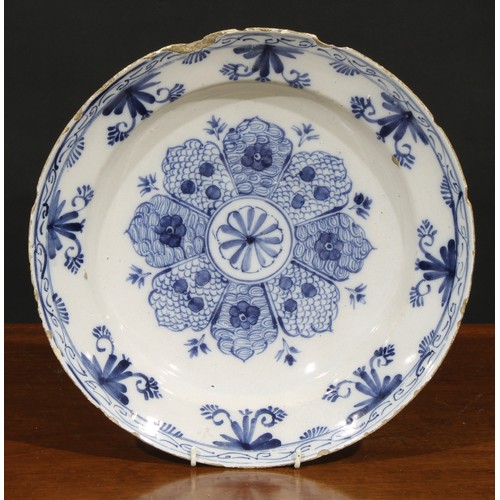 7 - A collection of six 18th and 19th century Delft chargers, the largest 36cm diameter (6)