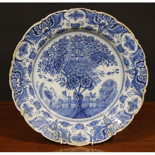 7 - A collection of six 18th and 19th century Delft chargers, the largest 36cm diameter (6)